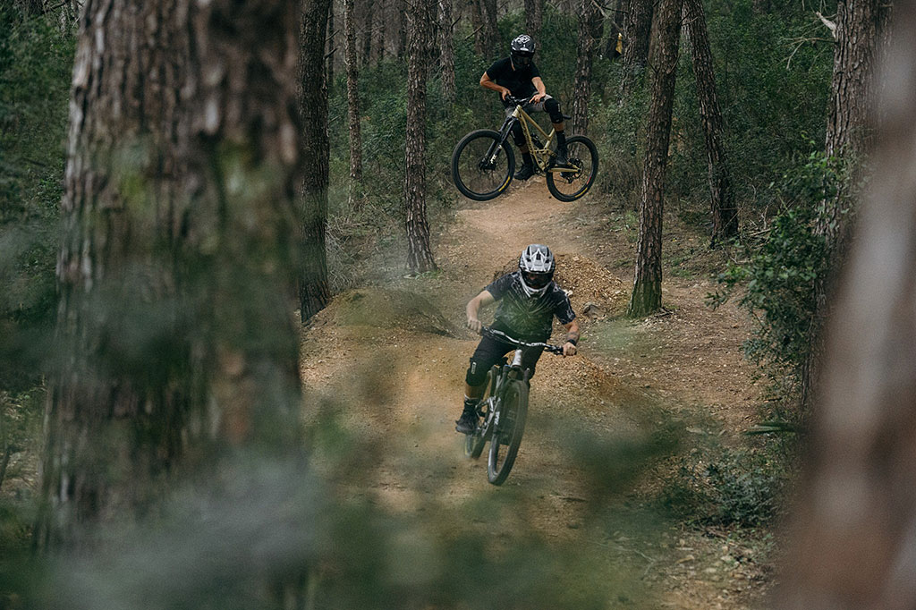 two buddies going down the hill on some trails in malaga